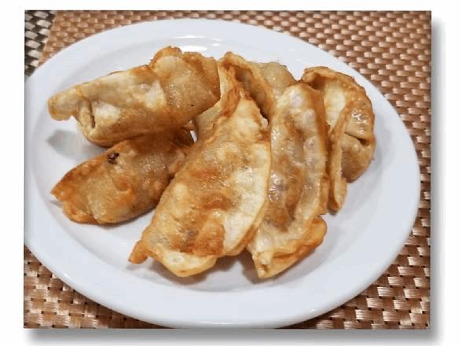 Order Gyoza: Crisp Japanese Dumplings food online from Racha Thai store, Seattle on bringmethat.com