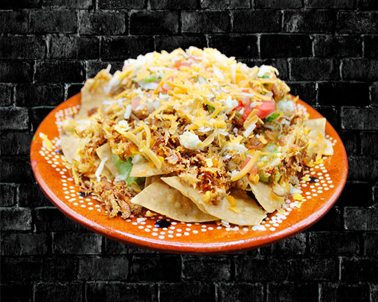 Order Carnitas Nachos food online from Rivas Mexican Grill#4 store, Henderson on bringmethat.com