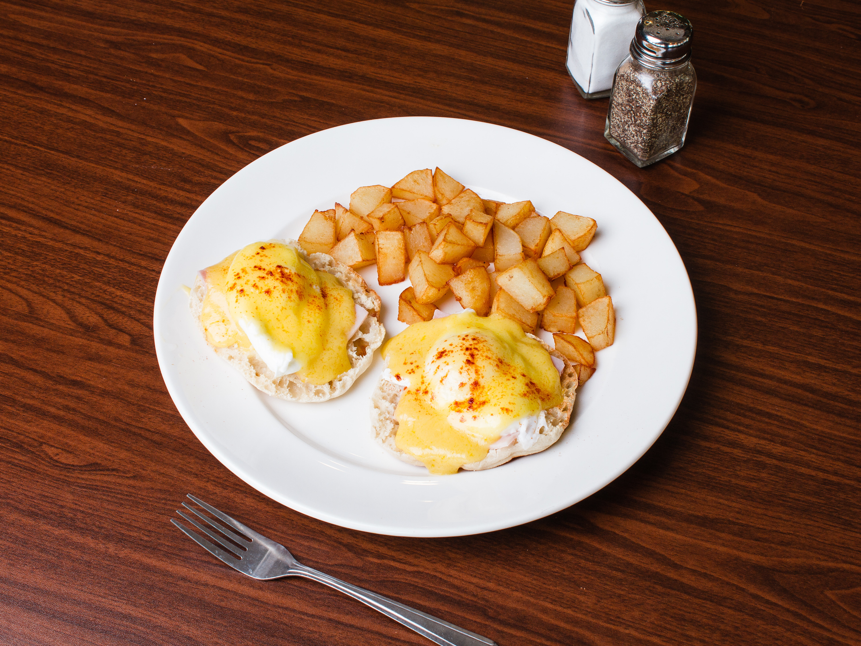 Order Eggs Benedict food online from Waffles And Company store, Virginia Beach on bringmethat.com